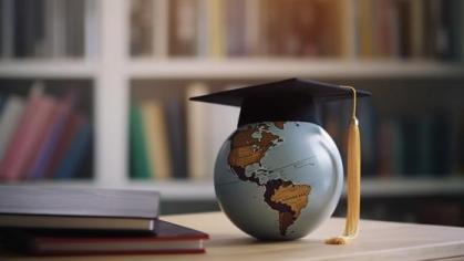 Globe with a graduation cap on