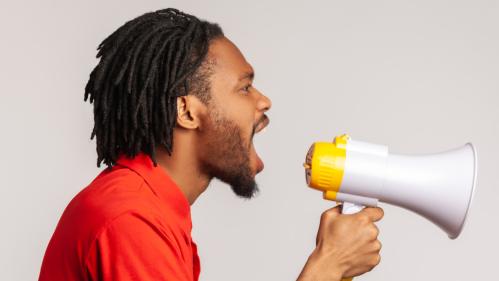 profile man loudly screaming megaphone making protest wants be heard