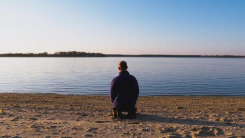 Person sitting on beach