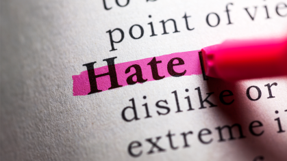 Open dictionary with the word Hate highlighted in pink