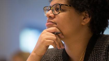Rutgers-Newark associate professor Patricia Akhimie looks pensive with her chin placed in her hand