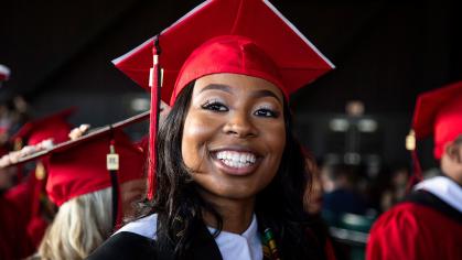 Spring 2022 commencement graduate smiling