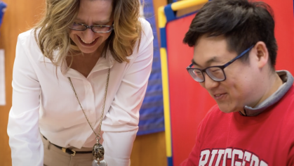 Lara Delmolino and a student at the Douglass Developmental Disabilities Center.