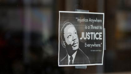A printed sign quotes Martin Luther King Jr., an international leader of the civil rights movement.