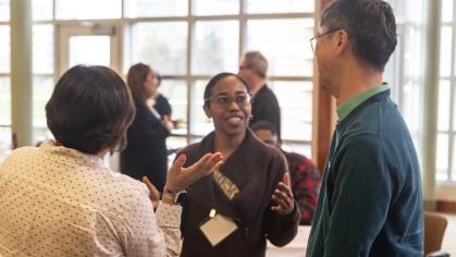 Faculty speaking in a group