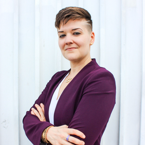 Headshot of Erica J. Friedman (They/She/He)