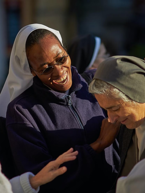 nuns joyfully gathered around