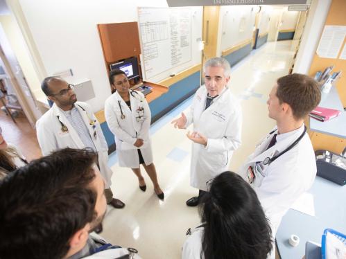 Professor and chair Division of Cardiology, Director Heart Failure Prevention and Treatment Program Marc Klapholz, MD (center) speaks with medical students on rounds