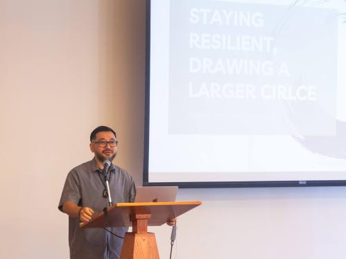 Kazu Haga speaking at the inaugural Navigating Tensions Affirming Community lecture