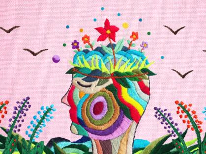 Surreal collage of a head with flowers growing out of it