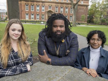 Diversity peer educators Brittany Burke (SEBS '23), left, and Ashlee Bonsi (SAS '23), right, flank Darnell Thompson, assistant director of education with the Center for Social Justice Education and LGBT Communities.