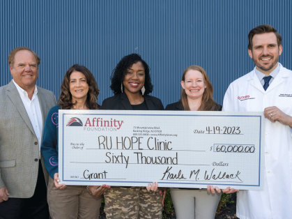 Rutgers H.O.P.E. Clinic director, Frank Giannelli (right), accepts a $60,000 check donation on April 19 from the Affinity Foundation, the nonprofit organization of Affinity Federal Credit Union. The gift allows clinic officials to expand primary health care services for underserved populations across central New Jersey. (R) Frank Giannelli, Jr. trustee, Affinity Foundation; MaryAnne Melanson, trustee, Affinity Foundation; Kawanzaa King, trustee, Affinity Foundation; Karla Wallack, executive director, Affini