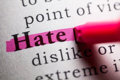 Open dictionary with the word Hate highlighted in pink