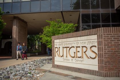 A photo of the concrete sign that says "The state of New Jersey Rutgers - Campus at Camden"