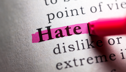 Open dictionary with the word Hate highlighted in pink