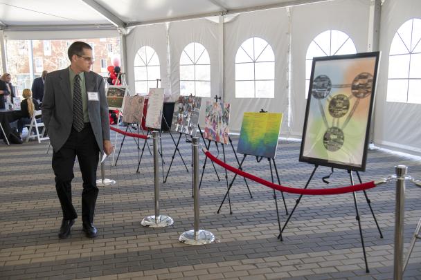 Charles R. Keeton II, Professor and Undergraduate Program Director, Department of Physics and Astronomy,  views winning artwork at the Beloved Community Awards celebration.