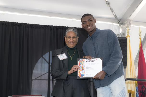 (l. to r.) Denise Rodgers (MD), Vice Chancellor Interprofessional Programs, RBHS , CACP Chair,  with Beloved Community Art Award 2nd place winner for Performing Arts category, Johnson Adesoye (Newark)