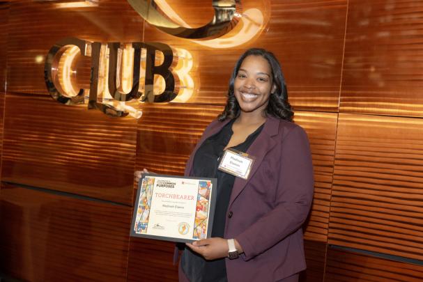 Madinah Elamin, Senior Director of Diversity, Equity, and Inclusion at Douglas Residential College is a 2024 Torchbearer Award recipient, at the Committee to Advance our Common Purposes Awards Ceremony.