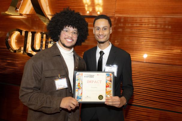 (l. to r.) Yardy and Yoel Bernard, representing HombRes Camden Division of Student Academic Success/TRiO Student Support Services, a Recognized Student Organization, receive the 2024 Impact Award at the Committee to Advance our Common Purposes Awards Ceremony.