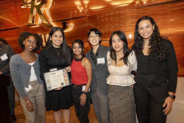 Students representing The Multicultural Inclusion, Diversity, Equity, & Actions (M.I.D.E.A.) from Rutgers Health, Rutgers Biomedical Health Sciences (RBHS), a Recognized Student Organization, receive the 2024 Impact Award at the Committee to Advance our Common Purposes Awards Ceremony.